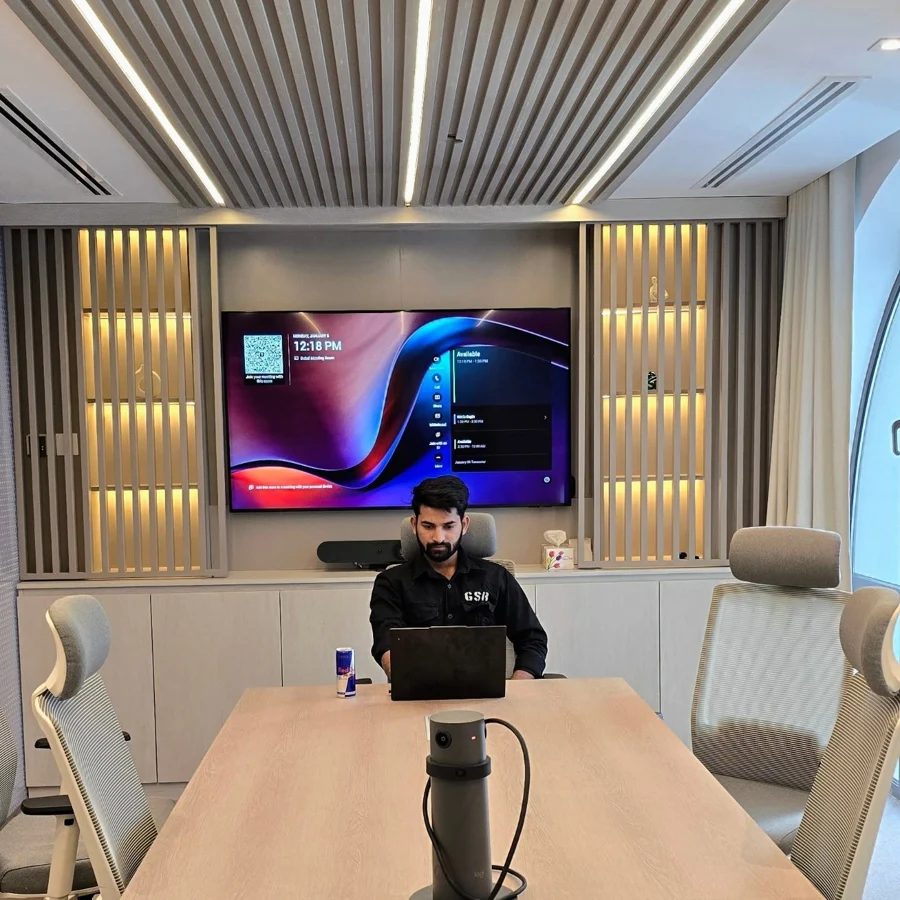Quantagen's original company photograph, showing a CEO in a meeting room